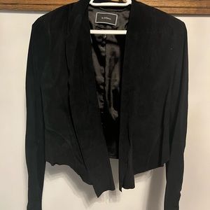 Fitted black jacket with stretchy sleeves, no buttons, size M